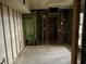 Unfinished basement features block walls, metal studs, and a door to outside at 253 Rex Pl # B, Madeira Beach, FL 33708