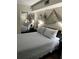 Nicely decorated bedroom featuring a comfortable bed and mirrored closet at 253 Rex Pl # B, Madeira Beach, FL 33708