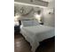 Nautical themed bedroom with stylish decor and a plush queen-sized bed at 253 Rex Pl # B, Madeira Beach, FL 33708