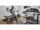 Community gym features elliptical, treadmill, stationary bike and mounted TV at 253 Rex Pl # B, Madeira Beach, FL 33708