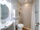 Updated bathroom features a walk-in shower with pebble floor and modern fixtures at 27130 Firebush Dr, Wesley Chapel, FL 33544