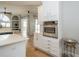 Modern kitchen with white cabinets, stainless steel oven, and quartz countertops at 27130 Firebush Dr, Wesley Chapel, FL 33544