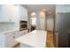 Bright kitchen featuring white cabinets, an island, and stainless steel appliances at 27130 Firebush Dr, Wesley Chapel, FL 33544