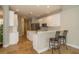 Open kitchen layout with stainless steel appliances, an island, and a breakfast bar at 27130 Firebush Dr, Wesley Chapel, FL 33544