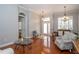 Open living space with hardwood floors, arched doorway, and natural light at 27130 Firebush Dr, Wesley Chapel, FL 33544