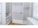 Custom designed walk-in closet featuring ample shelving and hanging space with window and natural light at 27130 Firebush Dr, Wesley Chapel, FL 33544