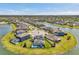 Stunning aerial view of a lakeside community, showcasing beautiful homes and scenic surroundings at 28683 Lucero Ln, Wesley Chapel, FL 33543