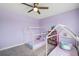 bedroom with two small house beds and decorated with books at 28683 Lucero Ln, Wesley Chapel, FL 33543
