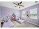 bedroom with two small house beds and decorated with musical instruments and books at 28683 Lucero Ln, Wesley Chapel, FL 33543