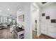 Bright hallway flows seamlessly into a living area, storage and laundry space at 28683 Lucero Ln, Wesley Chapel, FL 33543