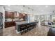 Expansive kitchen featuring a large island, modern lighting, and open layout at 28683 Lucero Ln, Wesley Chapel, FL 33543