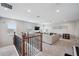 Spacious loft with a comfortable seating area, tv, and an abundance of natural light at 28683 Lucero Ln, Wesley Chapel, FL 33543
