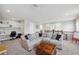 Upstairs loft area with comfortable sectional couch, wooden chest table, and built-in desk at 28683 Lucero Ln, Wesley Chapel, FL 33543