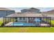 Relaxing screened-in pool area provides a private outdoor retreat with ample space for seating and recreation at 28683 Lucero Ln, Wesley Chapel, FL 33543