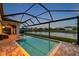 Enjoy serene water views from this beautiful pool and patio area, perfect for outdoor entertaining at 28683 Lucero Ln, Wesley Chapel, FL 33543