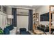 Home office with a desk, chair, shelving, and sofa at 29536 Zupetta Ln, Wesley Chapel, FL 33545