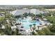 Resort-style pool area featuring palm trees, lounge chairs, and shaded cabanas for luxurious relaxation and enjoyment at 29536 Zupetta Ln, Wesley Chapel, FL 33545