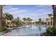 Large pool with palm trees and lounge chairs at 29536 Zupetta Ln, Wesley Chapel, FL 33545