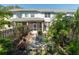 Backyard area of the property with a patio surrounded by lush greenery at 2983 Covewood Pl, Clearwater, FL 33761