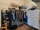 Walk-in closet with wire shelving, racks of hanging clothes, and shoe storage at 2983 Covewood Pl, Clearwater, FL 33761