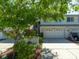 Charming townhome featuring a two-car garage and a well-maintained lawn at 2983 Covewood Pl, Clearwater, FL 33761