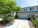 Charming townhome featuring a two-car garage and a well-maintained lawn at 2983 Covewood Pl, Clearwater, FL 33761