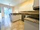 Well-lit kitchen with granite countertops and modern appliances at 2983 Covewood Pl, Clearwater, FL 33761