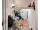 Pantry with a light on the ceiling and wire racks filled with groceries at 2983 Covewood Pl, Clearwater, FL 33761