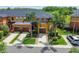 Overhead view of the townhomes showcasing landscaping and a private parking area at 30130 Mossbank Dr, Wesley Chapel, FL 33543