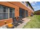 Backyard with outdoor seating, stone patio, and the exterior of the property at 30130 Mossbank Dr, Wesley Chapel, FL 33543