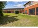 View of lawn and patio area from building corner at 30130 Mossbank Dr, Wesley Chapel, FL 33543