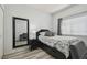 Comfortable bedroom featuring a large mirror and modern decor at 30130 Mossbank Dr, Wesley Chapel, FL 33543