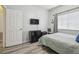 Charming bedroom with a TV, coastal decor, and comfortable furnishings at 30130 Mossbank Dr, Wesley Chapel, FL 33543