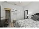 Well-lit bedroom with decor, closet and wood-look floors at 30130 Mossbank Dr, Wesley Chapel, FL 33543