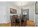 Elegant dining room with hardwood floors, chandelier, and wooden furniture for a warm atmosphere at 30130 Mossbank Dr, Wesley Chapel, FL 33543