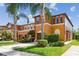 Beautiful townhome featuring a well-maintained lawn, mature landscaping and private, attached garage at 30130 Mossbank Dr, Wesley Chapel, FL 33543