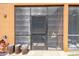 Close up view of the screened lanai, exterior patio and a glimpse into the outdoor relaxation area at 30130 Mossbank Dr, Wesley Chapel, FL 33543