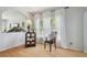 Bright and airy living room with large windows, stylish curtains, hardwood floors, and elegant decor at 30130 Mossbank Dr, Wesley Chapel, FL 33543