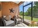 Cozy screened patio with comfortable seating and outdoor views at 30130 Mossbank Dr, Wesley Chapel, FL 33543