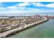 Aerial view of the property and surrounding neighborhood near the waterfront and beach at 3214 E Maritana Dr, St Pete Beach, FL 33706