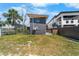View of the side and back yard showing part of a lush lawn at 3214 E Maritana Dr, St Pete Beach, FL 33706