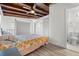 Bedroom featuring a ceiling fan and an ensuite bathroom with marble floors at 3214 E Maritana Dr, St Pete Beach, FL 33706