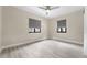 A bright bedroom with gray roller shades and light wood vinyl flooring at 3214 E Maritana Dr, St Pete Beach, FL 33706