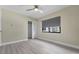 A bright bedroom with gray roller shades, closet and light wood vinyl flooring at 3214 E Maritana Dr, St Pete Beach, FL 33706