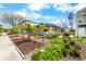 Well-maintained home exterior with lush landscaping and palm trees in the front yard at 3214 E Maritana Dr, St Pete Beach, FL 33706