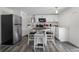 Charming eat-in kitchen features white cabinets, stainless steel appliances, and a modern design at 3214 E Maritana Dr, St Pete Beach, FL 33706