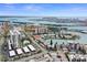 Scenic aerial view showcasing the waterfront condos with a pool and covered parking at 400 Larboard Way # 103, Clearwater, FL 33767