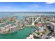 Breathtaking aerial view highlighting waterfront condos, boat docks, and vast ocean at 400 Larboard Way # 103, Clearwater, FL 33767