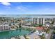 Expansive aerial view of a coastal community highlighting the waterfront homes at 400 Larboard Way # 103, Clearwater, FL 33767