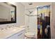 Bathroom with white tiled walls, a modern vanity, and a tub with a unique shower curtain at 400 Larboard Way # 103, Clearwater, FL 33767